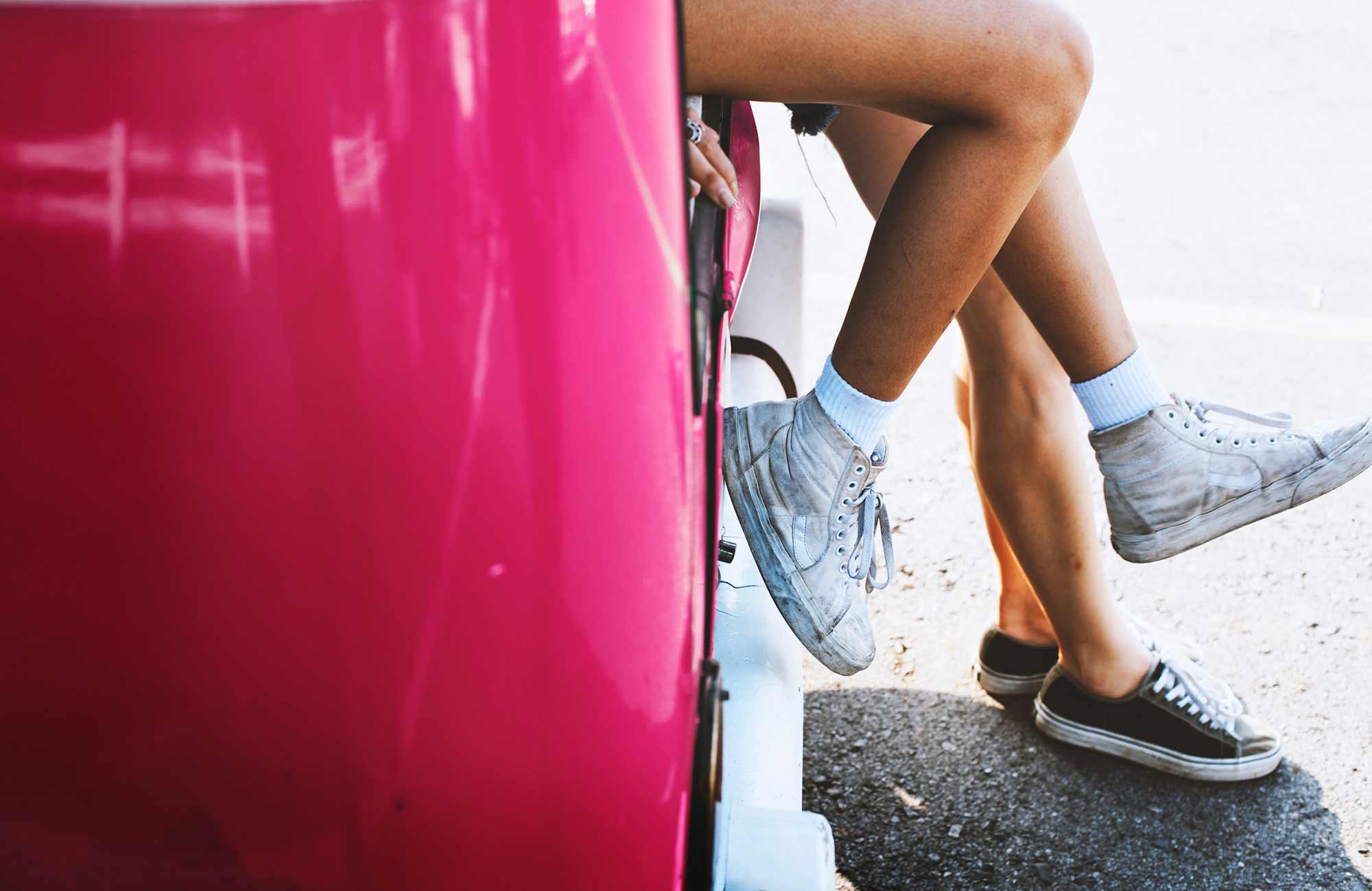 roadtrip-legs-people-leaning-car-cover