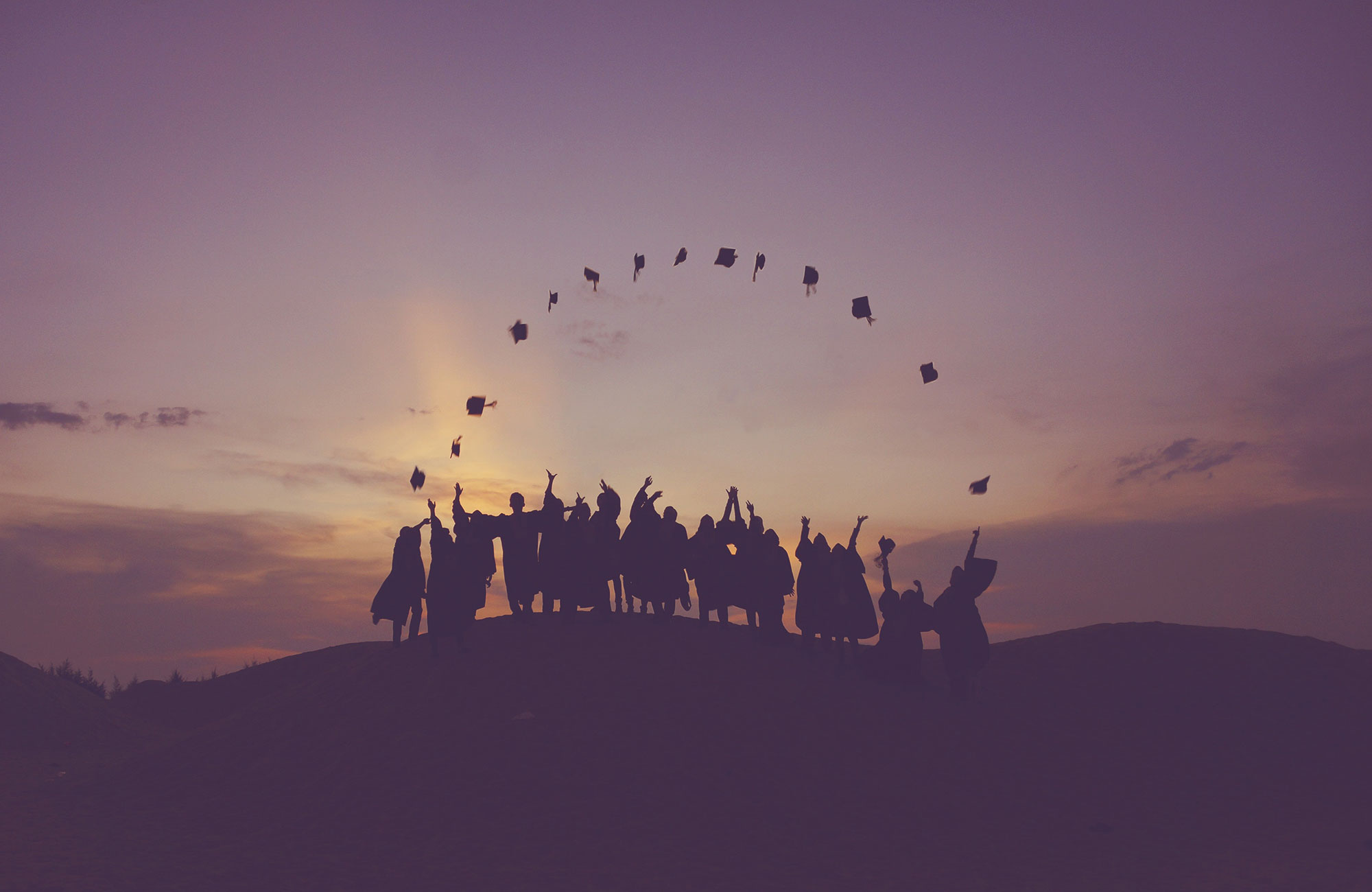graduation-students-celebration-sunset